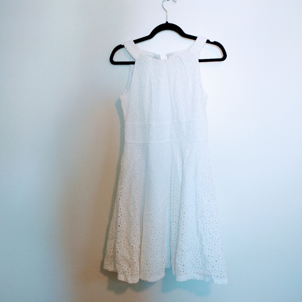 London style collection white eyelet dress, high neckline with flared skirt. Lin